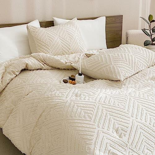 Cozy bed with textured cream bedding and pillows.