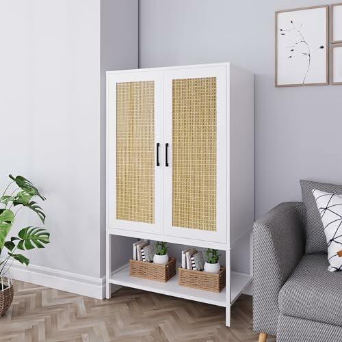 White cabinet with wicker doors beside gray sofa and plant.