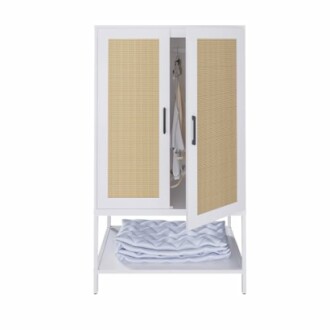 White wardrobe with wicker doors and a folded blanket inside.